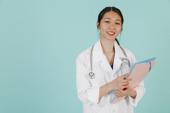 smiling-asian-doctor-with-stethoscope-folder
